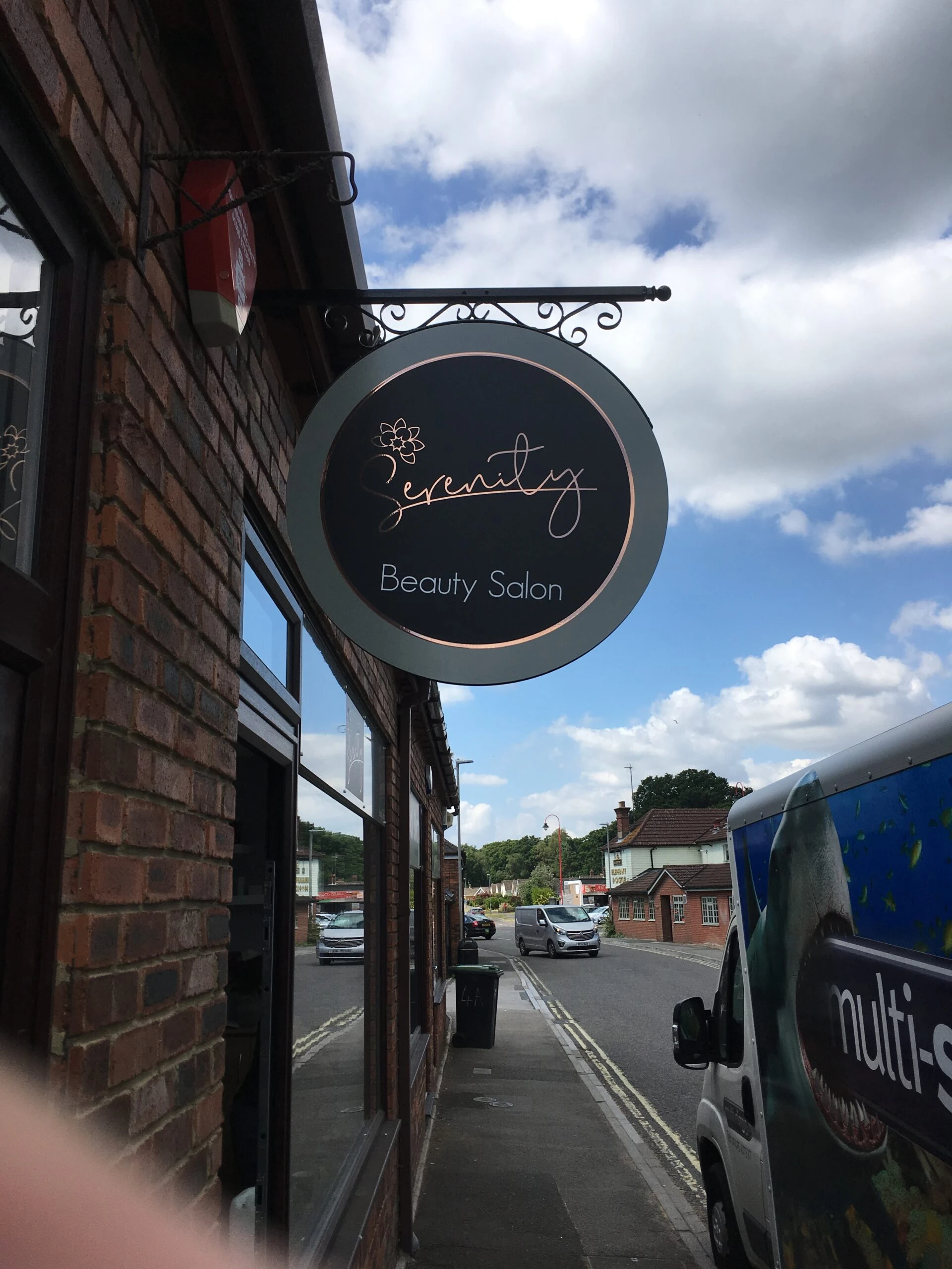 Projecting signage, hanging signage, graphic design bespoke signage, bespoke design, advertising, road side signage